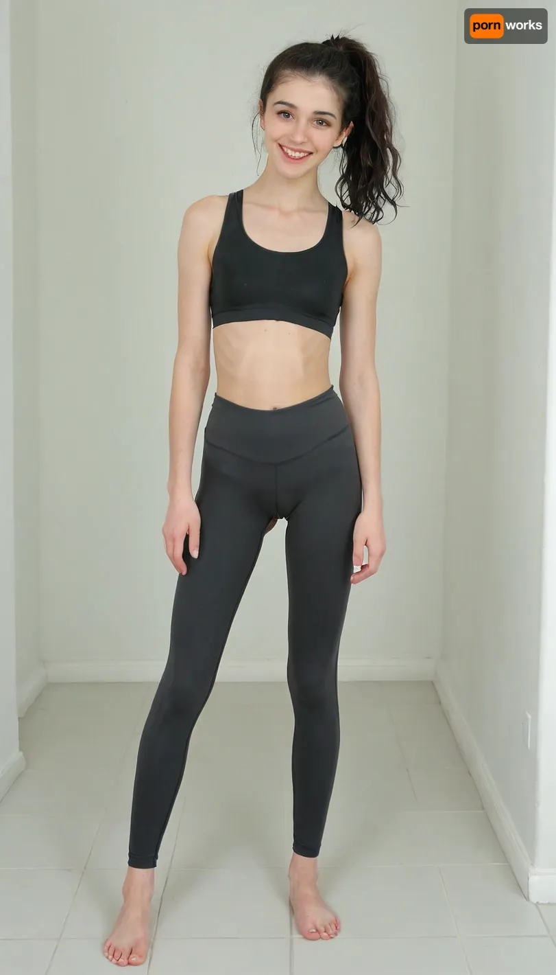 A young petite timid college girl of 1m60 height, bathroom, smiling at me. black wavy hair in a ponytail. wearing long black highwaisted runningpants, wearing black sportsbra, playful, realistic skin with many moles and imperfections, anorexic, slender figure, Detailed natural skin and blemishes without-makeup, close, perfect eyes, skin blemish, facing you, front view, bare feet, slimwoman, flat chested, <lora:pyroV4-256:2>, <lora:flat_chested_v3.5:.8>, Detailed natural and blemishes without-makeup, <lora:skin_4-000015:.3>