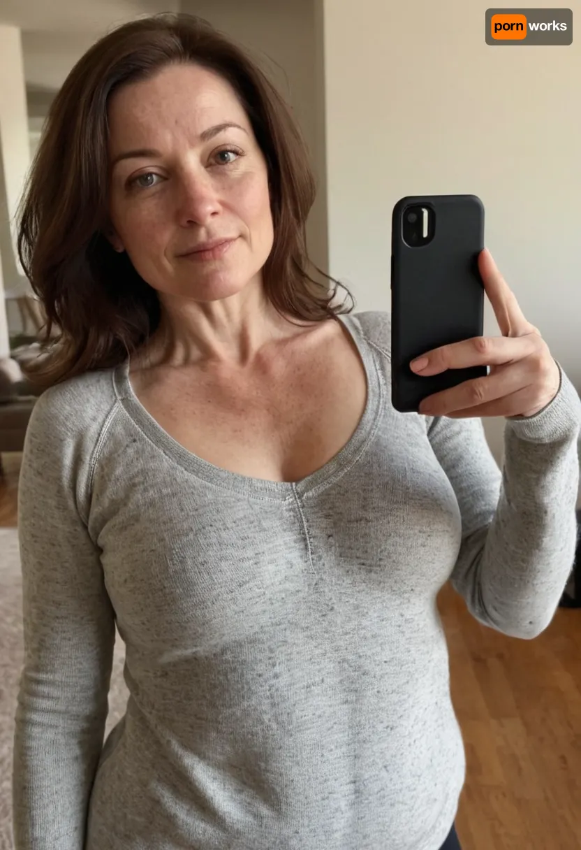 solo, 1girl, 52 year old woman, very plain jane, girl next door, no makeup, average looking, brunette hair with grey streaks, very pale body, ((curvy body with smaller breasts)), taking a selfie, wearing a sweater and yoga pants, freckles, (((medium-small breasts))), 36C breasts