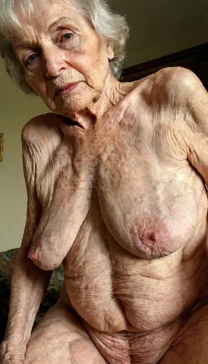 The old woman scrolled through pictures of herself from the past, showing off her wrinkled saggy pussy. She selected a picture of herself from a few years ago, showing off her smooth pale skin and toned body