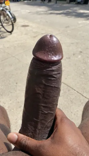 The protagonist, a young man in his early twenties, was walking down the street when he stumbled upon a giant black cock. He couldn't help but stare at it as he walked by, imagining what it would feel like to have that monster