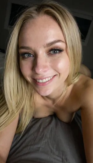 A night's intimate embrace: a realistic selfie in shadows - a 21-year-old blonde's daring display