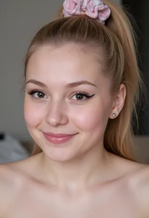 White blonde girl smiling, intimate face shot, mascara, eyeliner, freckles, high ponytail with scrunchie, lipstick, heavy makeup