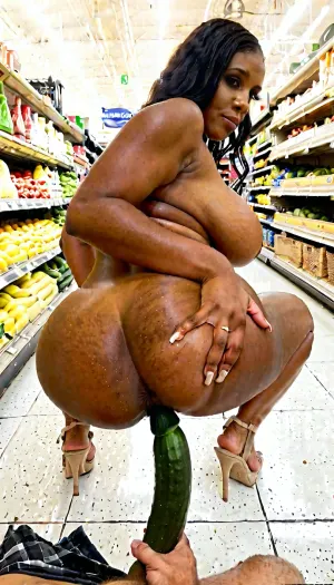 Beautiful thick black woman with huge tits naked in the middle of the vegtable aisle in a grocery store, squatting on a big cucumber in her ass, while others are shopping and watching her clapping thier hands. Full nudity