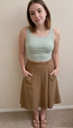 Raw pictures, shy modest tired curvy woman 38yo 70kg, walking, (thick body:1.2), (wearing a ribbed tank top tucked into a flowy midi skirt with pockets, espadrille sandals. Her outfit is in earthy pastel tones:1.4), bad light, dark light, disheveled hair, hair cut in bob, straight dark brown hair, natural skin, visible pores, freckles, slight acne scars, redness around the nose, and uneven skin texture, high quality, Best quality, realistic, (person in the frame but poorly centered, partially cropped out:1.1), off-frame composition, head cut off, awkward camera angle, unbalanced shot