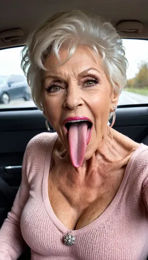 smile skinny brigitte nilsen old granny, smile gilf streches out her extreme long tongue, usa pervert old bodybuilding muscle woman gilf with long tongue, silikon fake boobs, open her mouth big, waiting for cumshot, in bed, smokey, lipstick, ginger short pixie hair cut, with very massive tits hugh boobs, sticks her extreme long tongue out of her mouth, big open mouth, in a car, wearing a silver pink rose transparent diamant silver tight sweater with tits free hole, hairstyle after sex, make up running down, kinky crazy granny