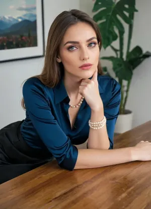 Skinny Instagram model, (Narrow chin, wide-set eyes, thin nose), straight long glossy ponytail hair, pink lipstick, Instagram photo, biting, own, lip, (satin dark blue office shirt, big long Pearl Necklace, satin thick wide long straight black skirt), sitting on office chair without table, ((head lying on table, She dropped her head on the table, arms lying on table, hands on table, bent over table, Her arms are folded under her head, head is lying on her hands, head is turned to one side, sleeping while sitting, head and arms lying on table))