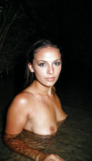 Naiad in misty river at night, mystical, detailed face