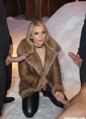 A highly detailed, photorealistic scene outside a dimly lit igloo. A pretty 24 yo women blonde hair name Natalii ukraiian foto galery Natalii model foto https, //www.deviantart.com/natalii24hot is kneeling on the packed snow floor near the center surrounded closely by men, giving handjob with great passion and dedication the large cock of her father's best friend, illuminated by the warm glow of a small, contained bonfire. She wears warm, fur-lined coat and very shiny black wetlook latex leggings. A group of 8 men stand next to her, he has a huge cock, dressed in similarly rugged attire, his face gently lit by the flickering firelight. The texture of the igloo’s ice blocks should be clearly visible, reflecting subtle hints of orange and yellow from the flame. The image should convey a quiet, intimate atmosphere, with soft shadows and realistic proportions.l, 4k, photorealistic, intricately detailed face