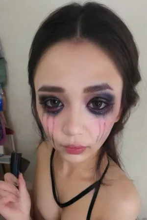 The girl was applying her makeup when she heard a loud noise outside. She looked out the window and saw a group of people running towards her house. They were all wearing masks and carrying weapons, and one of them had their victim in their car