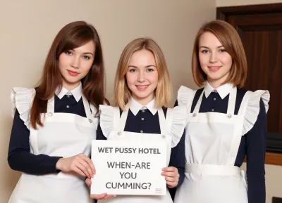 Three petite young women, wearing maid uniforms, different haircolors, standing at a hotel reception.
They hold a sign with text "WET PUSSY HOTEL, WHEN ARE YOU CUMMING?".