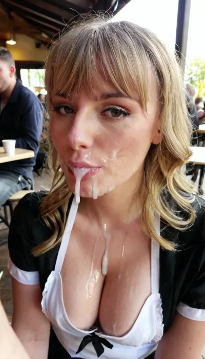 Amature 21 year old athletic barmaid, bangs wavy blonde hair, cleavage, shirt, apron, face covered in loads of semen, face glazed with cum from a lot of men, cum in hair, cum on the forehead, cum on the nose, cum on cheeks, cum on mouth, cum dripping off chin, in crowded cafe terrace, sun light, wide shot