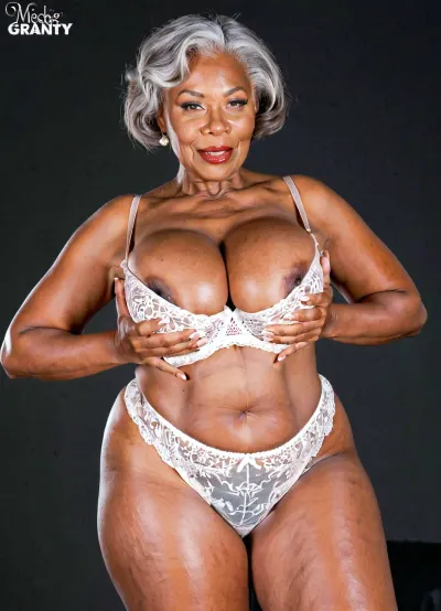 65 years old ebony grandmother with oversized massive breast takes different poses, ordinary wrinkled granny, perfect granny's curvy body and face, model for lingerie catalog, lingerie advertising design, price displayed, big brand logo, photo shooting High quality photo, high detailed photo, wide shot, professionnal photo studio