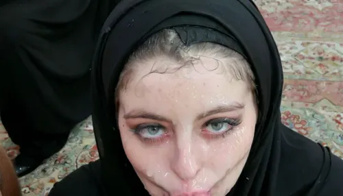 (wearing black hijab), realistic face, very messy hijab, pale skin, in front of kaaba, one finger on face, close shot, pouting, <lora:JustCum:1>, <lora:Pouting_SDXL:.5>