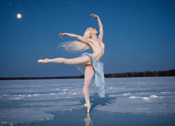 A photorealistic image of a woman with long wild white hair, extremely pale skin, extremely pale face, albino, high cheekbones, skinny, ballet dancer, naked, light blue ribbons that billow around her as she moves, tilted backward, one leg lifted high, her bare feet accentuating her ballet technique, arms are elegantly extended, one reaching upward and the other slightly backward, dancing on a frozen lake, covered in ice, night sky, gigantic full moon covering the whole background