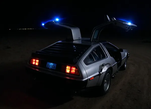 DeLorean from BTTF, (Back to the Future), Night, Dark Sky, Road in Desert, Real Road, Lights of DeLorean, (Travel Time Effects, Driving to 88mph, Blue Lights on Components Located on the Wings of the DeLorean, Blue Flash, Blue Flashes from the DeLorean), Marty McFly Sits in the DeLorean and Drives it, Side View from Above, <lora:dark:.5>