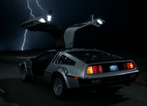DeLorean from BTTF, (Back to the Future), Night, Dark Sky, Road in Desert, Real Road, Lights of DeLorean, (Travel Time Effects, Driving to 88mph, Driving Effects, Blue Lights on Components Located on the Wings of the DeLorean, ((Blue Flash, Blue Flashes from the DeLorean, Blue Fire Flashes, Lightning Flashes all Around the DeLorean))), Marty McFly Sits in the DeLorean and Drives it, Side View from Below, <lora:dark:.5>