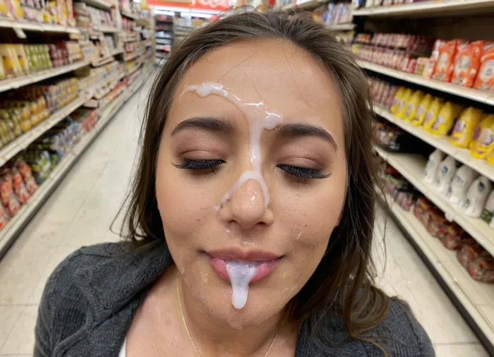 very cute and beautiful classy young woman, face covered in semen and cum, crowded supermarket